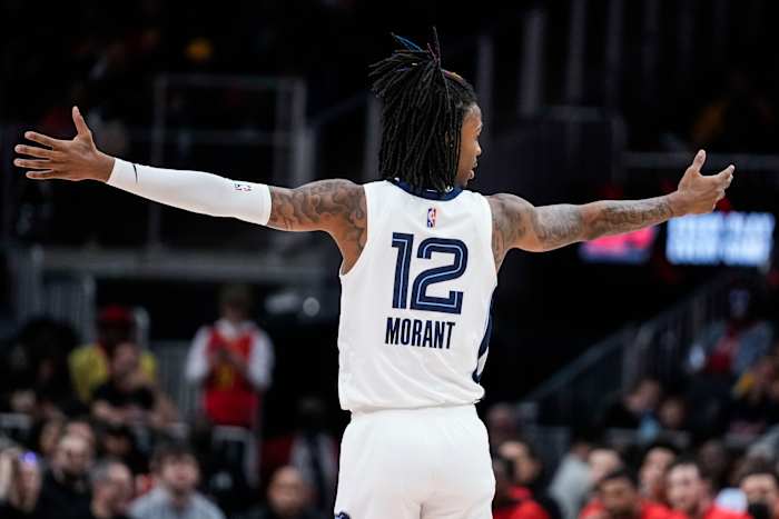 Memphis Grizzlies guard Ja Morant reacts after his team makes a shot.